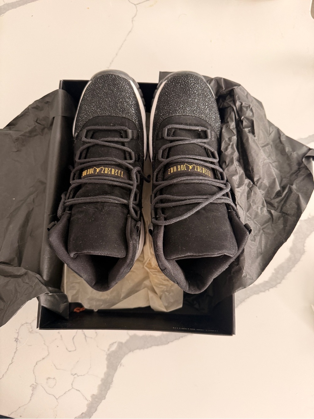 Jordan Black High-Top Sneakers with Gold Tongue Detail